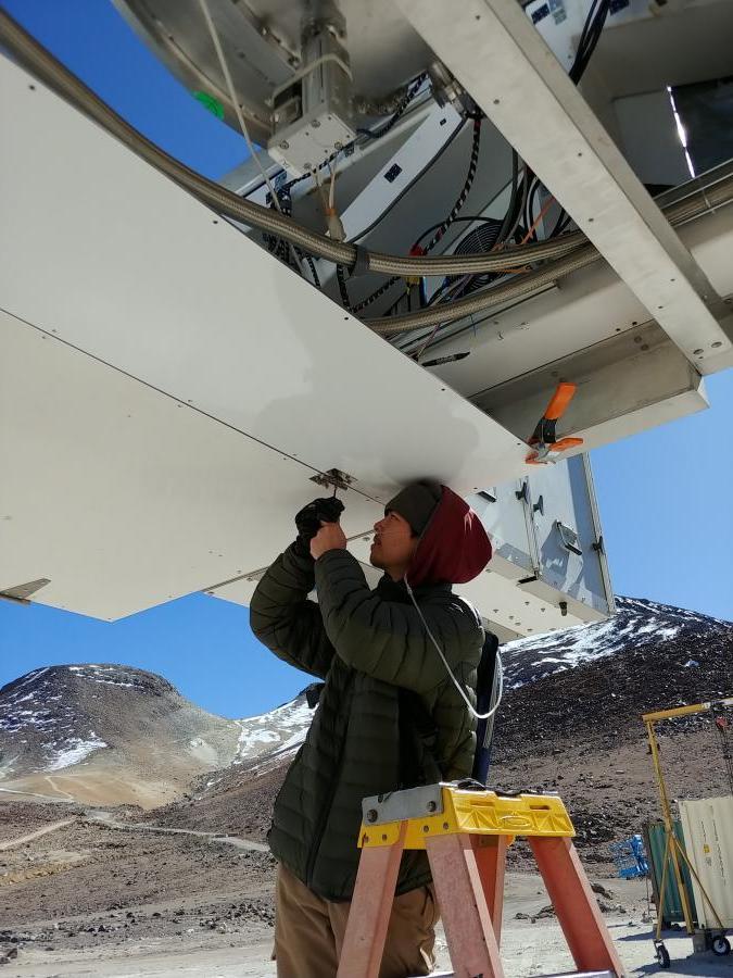 Student Michael Lew works on a telescope at 17,000 feet